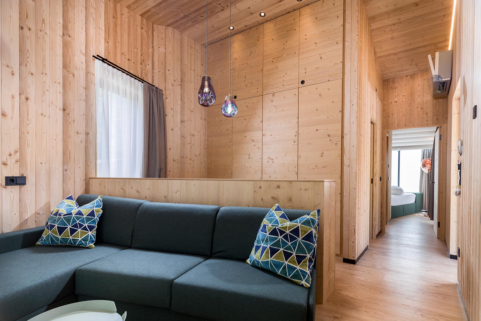 Interior view of SkyView Chalet - Couch with cushions • SkyView Chalets Toblacher See