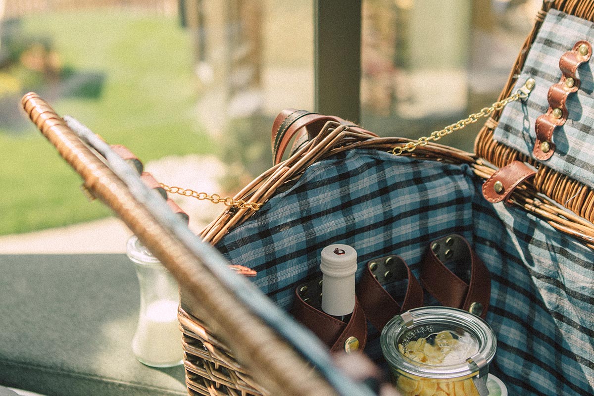 Close-up of breakfast basket with cheese & bread • SkyView Chalets Toblacher See